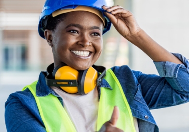 Female African American worker hearing protection